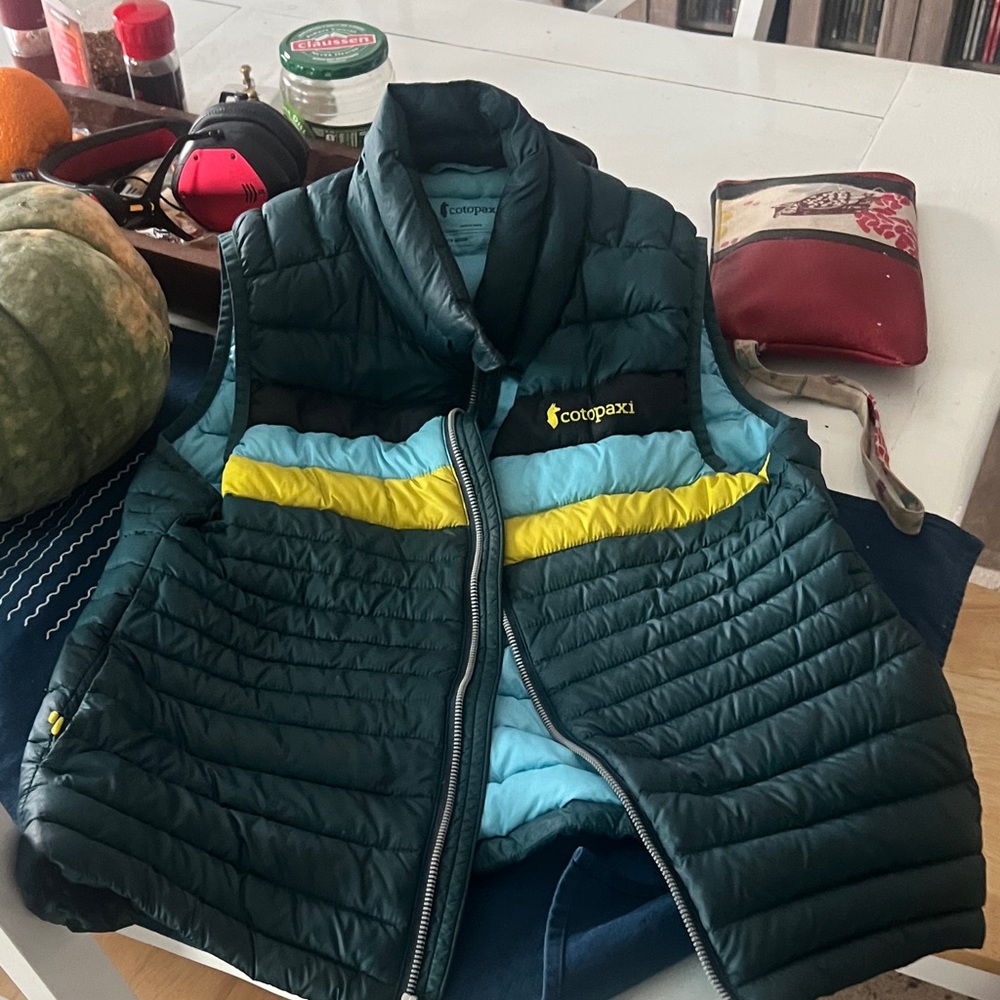 Cotopaxi Insulated Vest with Green, Blue, and Yellow